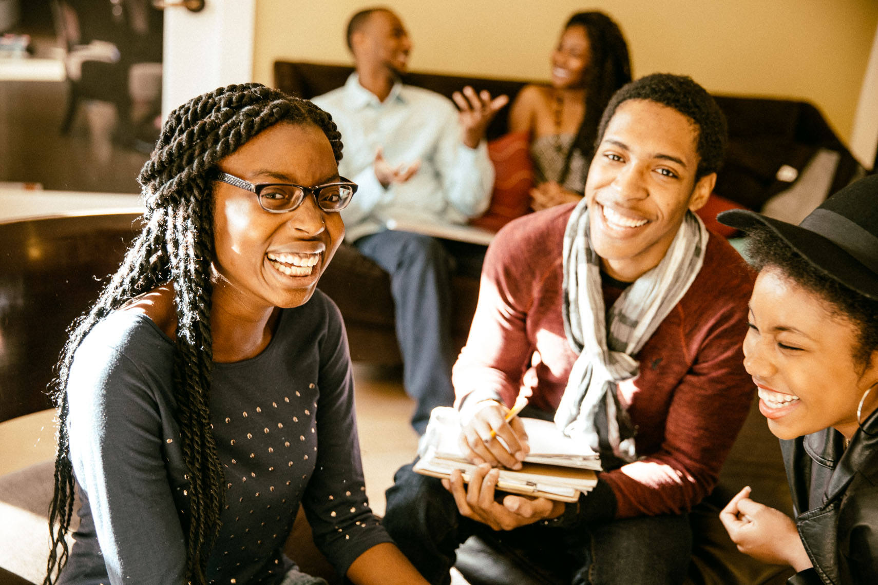 College students laughing in a study group.