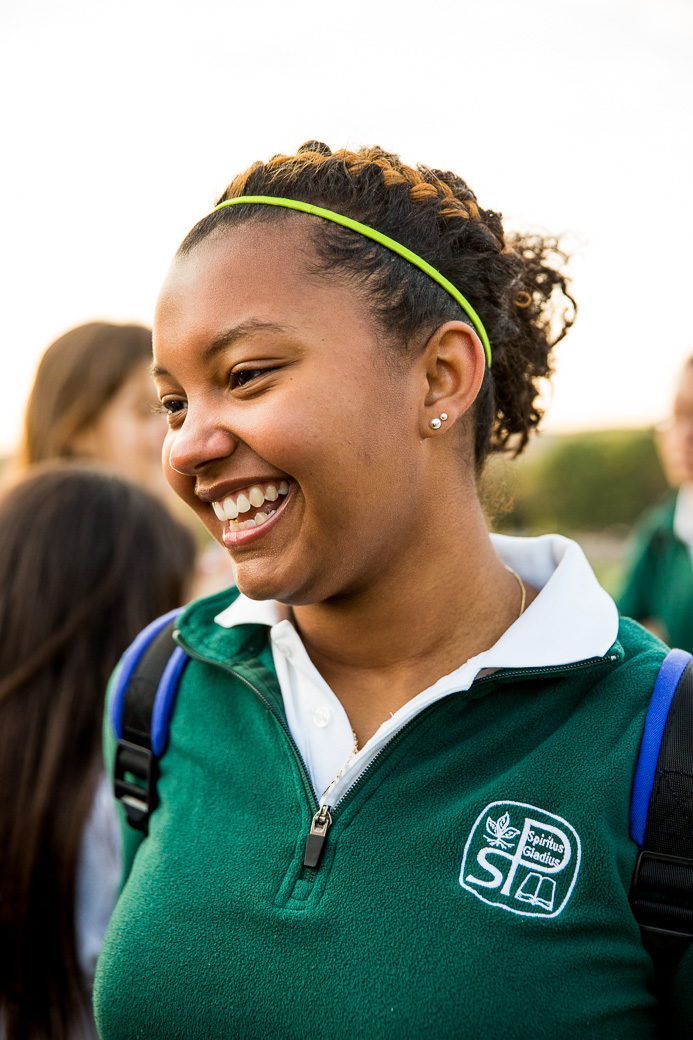 Young female African American student in school uniform.