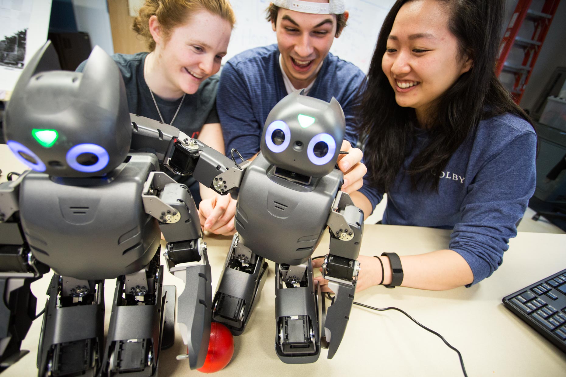 Students with robots in lab