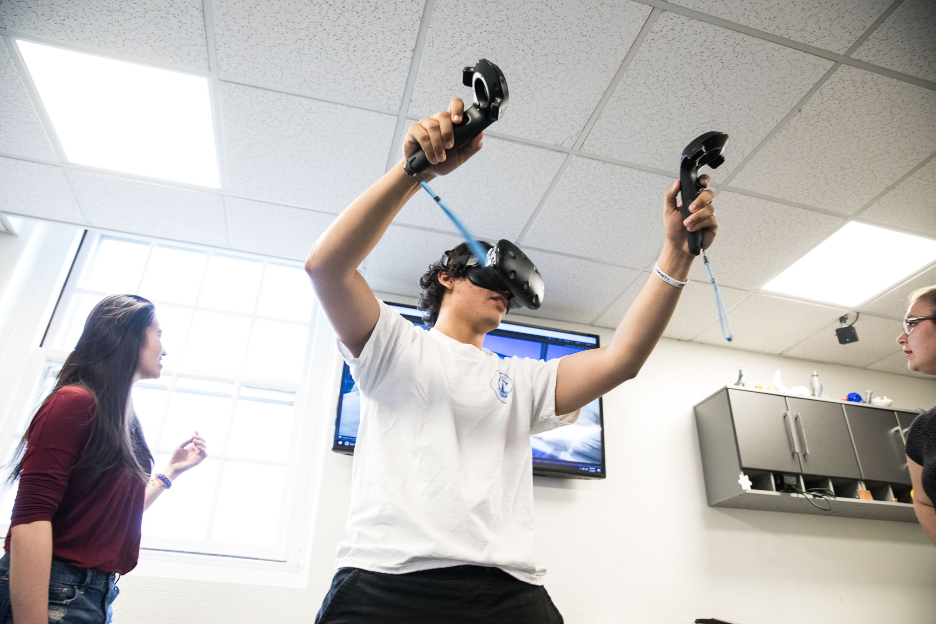 Student using virtual reality goggles.