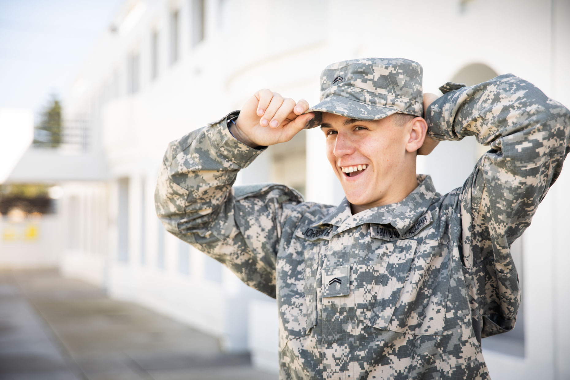 Smiling boy with military school uniform.